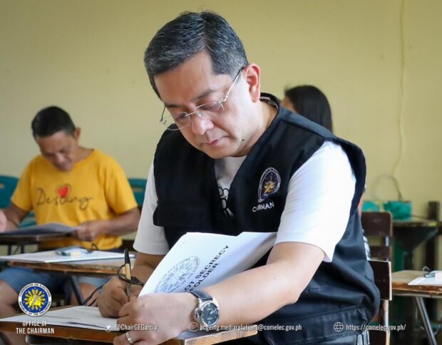 Commission on Elections chair George Erwin Garcia casts his vote for the Barangay and Sangguniang Kabataan Election (BSKE) at the Banaba Cerca Integrated School in Indang, Cavite on Monday, October 30, 2023. Photo from Comelec