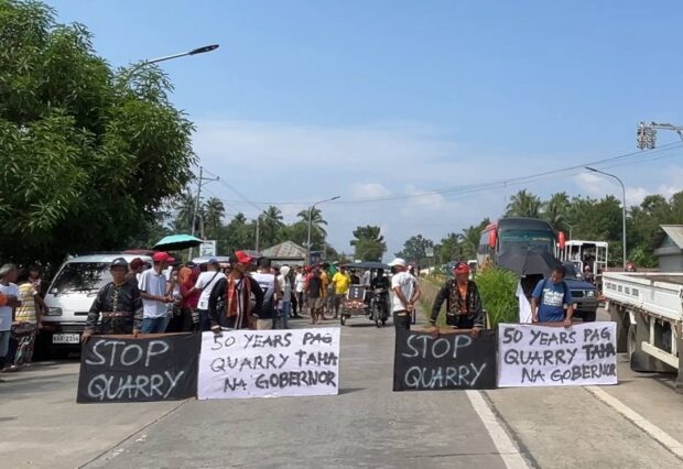 Subanen and Moro peoples in Labangan town, Zamboanga del Sur called attention on the worsening impact of quarry operations along the Labangan River on their communities during a rally along the national highway in Tapodoc village on Wednesday morning. LEAH D. AGONOY