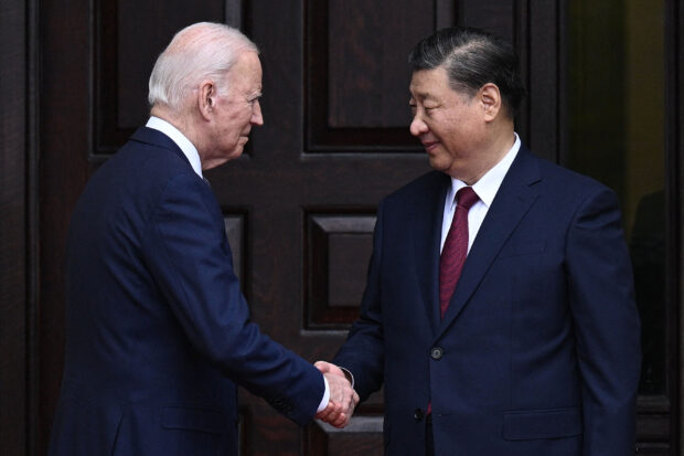 US President Joe Biden greets Chinese President Xi Jinping before a meeting during the Asia-Pacific Economic Cooperation (APEC) Leaders' week in Woodside, California on November 15, 2023. Biden and Xi will try to prevent the superpowers' rivalry