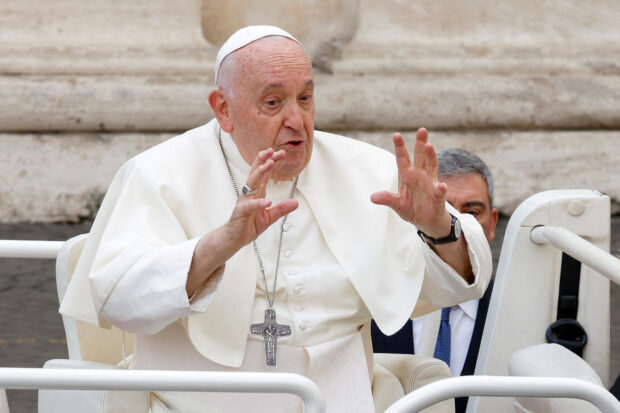 Pope Francis gestures as he leaves after the weekly general audience, in Saint Peter's Square at the Vatican, November 15, 2023. REUTERS/Remo Casilli/File photo