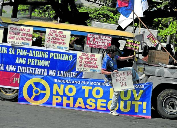DRIVERS’ CALL A jeepney at Baclaran district in Parañaque City has become a virtual protest wall as it displays streamers and banners voicing out the sentiments of drivers on Monday, the first day of a planned three-day transport strike. —RICHARD A. REYES