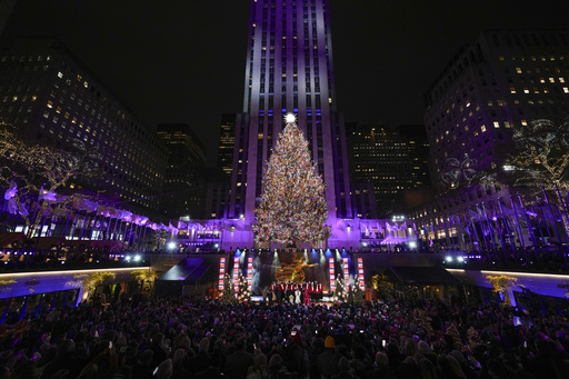 Iconic Christmas tree at Rockefeller Center illuminated 