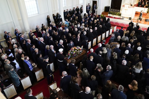 The casket of former first lady Rosalynn Carter, arrives inside Glenn Memorial Church, Tuesday, Nov. 28, 2023, in Atlanta. (AP Photo/Andrew Harnik)