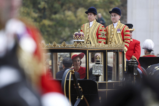 Britain's Prince William and Kate, Princess of Wales, ride in a carriage during a welcome ceremony for South Korea's President Yoon Suk Yeol on the occasion of his three-day state visit to the UK, in London, Tuesday, Nov. 21, 2023. (Hannah McKay/Pool Photo via AP)