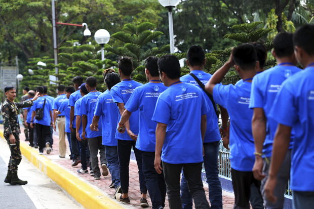 FEBRUARY 07, 2018Some of the 217 New Peoples Army surrenderees take a long queue as they walk towards the AFP's buses after a briefing program at the Armed Forces of the Philippines Officer's Club in Camp Aguinaldo, Quezon City. EDWIN BACASMAS