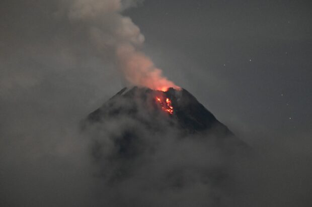 Mayon Volcano is lit up by an “incandescent” lava flow