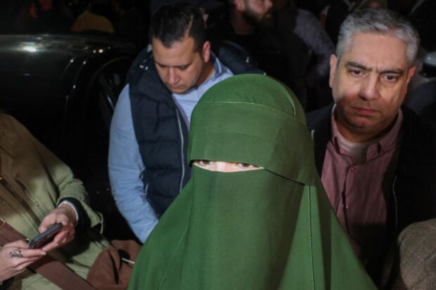 Nour Al-Taher (C) a Palestinian prisoner held in an Israeli prison looks on after her release under a truce deal between Israel and Hamas 