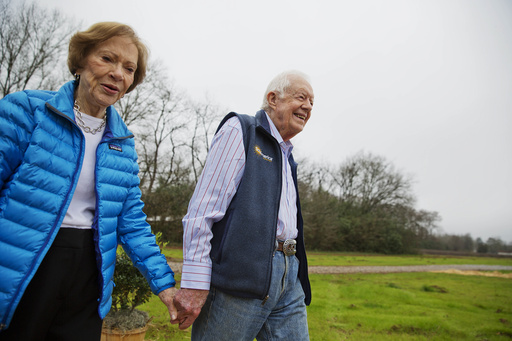 FILE - In this Feb. 8, 2017, file photo former President Jimmy Carter, right, and his wife Rosalynn arrive for a ribbon cutting ceremony for a solar panel project on farmland he owns in their hometown of Plains, Ga Jimmy and Rosalynn Carter have been best friends and life mates for nearly 80 years. Now with the former first lady's death at age 96, the former president must adjust to life without the woman who he credits as his equal partner in everything he accomplished in politics and as a global humanitarian after their White House years.(AP Photo/David Goldman, File)