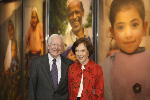 FILE - In this Sept. 28, 2009, file photo former President Jimmy Carter and his wife Rosalynn look at a new interactive exhibit at the Jimmy Carter Library and Museum in Atlanta. Jimmy and Rosalynn Carter have been best friends and life mates for nearly 80 years. Now with the former first lady's death at age 96, the former president must adjust to life without the woman who he credits as his equal partner in everything he accomplished in politics and as a global humanitarian after their White House years. (AP Photo/John Bazemore, File)