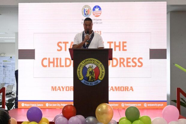 San Juan City Mayor Francis Zamora delivers his State of the Children Address as part of the celebration for the National Children's Month. Part of the event was signing a memorandum of agreement with DSWD USEC Angelo Tapales, Executive Director of the Council for the Welfare of Children, for the MAKABATA Helpline which can be contacted through phone or social media to report violence against children.