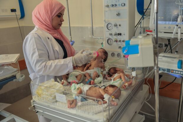 A Palestinian medic cares for premature babies, evacuated from Gaza City's Al Shifa hospital, ahead of their transfer from a hospital in Rafah in the southern Gaza Strip to Egypt, on November 20, 2023, amid ongoing battles between Israel and the militant group Hamas. 