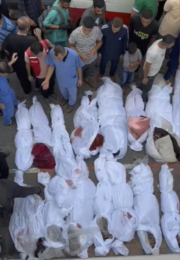 This image grab taken from AFPTV video footage shows the bodies of Palestinians killed in a strike on a refugee camp in Jabalia on the northern Gaza Strip on October 31, 2023, amid relentless Israeli bombardment of the Palestinian territory.