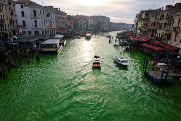 Italian climate change protesters turn Venice's Grand Canal green