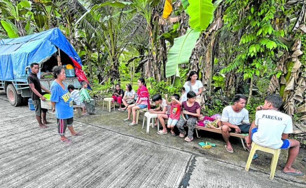 OPEN SPACE Residents of Barangay Bituon in Hinatuan, Surigao del Sur have camped on the streets since Sunday for fear that their houses would give way to the continuing strong aftershocks caused by the magnitude 7.4 earthquake that struck off the coast of the town at 10:37 p.m. on Saturday. ERWIN M. MASCARIÑAS