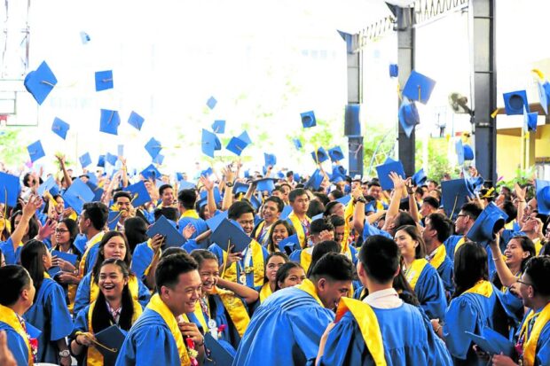 A BATCH TO WATCH Students at Quezon City Science High School celebrate at the end of commencement exercises marking their completion of Grade 12 under the K-12 program. Photo taken on April 6, 2018. 