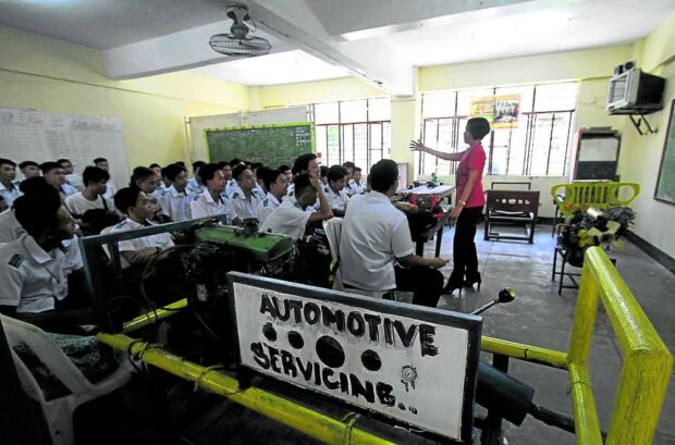 PHOTO: Grade 11 students taking the technical-vocational-livelihood track under the K-12 curriculum are introduced to the subject of automotive servicing, in this photo taken on June 13, 2016, at Parañaque National High School in Parañaque City. STORY: Marcos wants DepEd, Tesda to work closely on TVET, SHS curriculum