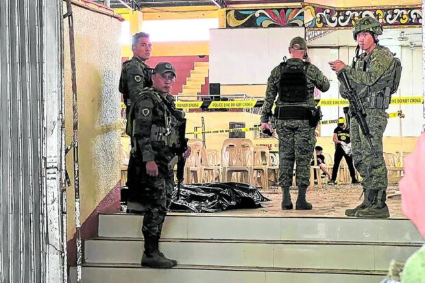 Security forces secure Dimaporo Gymnasium at Mindanao State University after the Dec. 3, 2023 bombing as investigators started a manhunt for the perpetrators. STORY: Suspect in Mindanao State University bombing surrenders – AFP