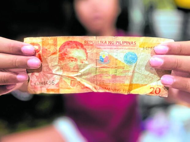 OLD BILL Old, crumpled and dirty P20 bills must be surrendered to the central bank for replacement. —REM ZAMORA