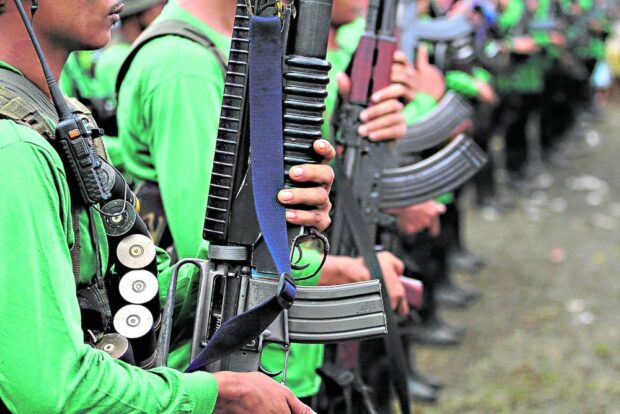 The New People’s Army, whose members are seen wielding high-powered firearms in this photo taken in Marihatag, Surigao del Sur, on Dec. 26, 2018, will lay down their weapons from Dec. 25 to Dec. 26, marking the 55th anniversary of the Communist Party of the Philippines. 