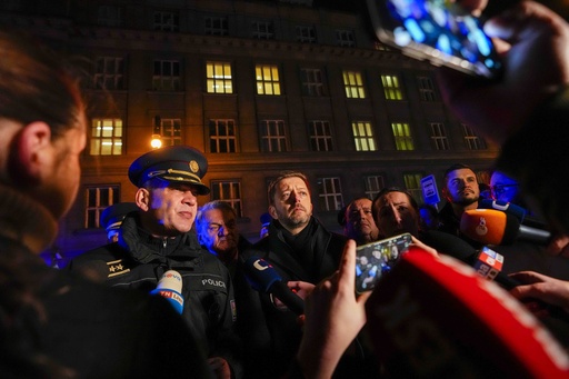 Czech Republic's Minister of the Interior Vit Rakusan, center, and Police officer Martin Vondrasek, left, speak to the media after a mass shooting in downtown Prague, Czech Republic, Thursday, Dec. 21, 2023. A mass shooting in downtown Prague killed several people and injured others, and the person who opened fire also is dead, Czech police and the city's rescue service said Thursday. (AP Photo/Petr David Josek)