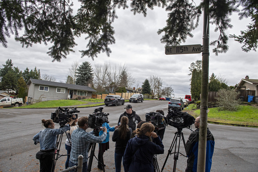 Sgt. Chris Skidmore, center, speaks to members of the media after five people were killed in a shooting, including the shooter, at a home in Orchards, Monday, Dec. 4, 2023, in. Vancouver, Wash. The Clark County Sheriff’s Office said the deaths Sunday appeared to be a murder-suicide. (Amanda Cowan/The Columbian via AP)