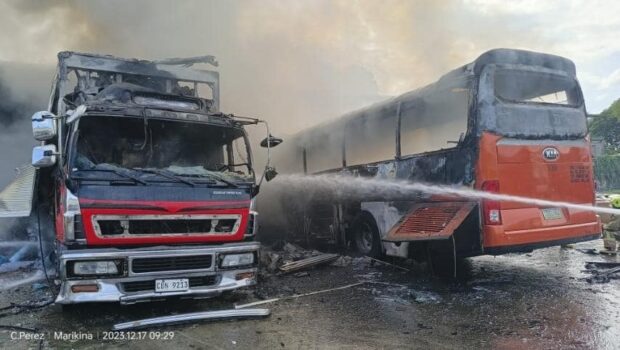 Fire engulfs a truck and bus parked at BFCT Terminal, Barangay Calumpang, in Marikina City on Sunday morning. According to the Bureau of Fire Protection, two people died and five others were injured in the incident. (Photo courtesy of Marikina Filipino - Chinese Fire Brigade Volunteers Facebook)