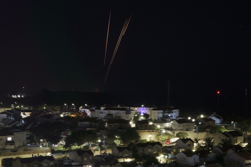 Rockets are fired toward Israel from the Gaza Strip as seen from southern Israel, Saturday, Dec. 2, 2023. (AP Photo/Leo Correa)