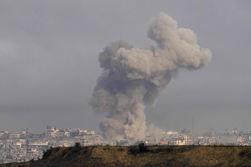 Smoke rises following an Israeli bombardment in the Gaza Strip, as seen from southern Israel, Wednesday, Dec. 27, 2023. The army is battling Palestinian militants across Gaza in the war ignited by Hamas' Oct. 7 attack into Israel. (AP Photo/Ohad Zwigenberg)