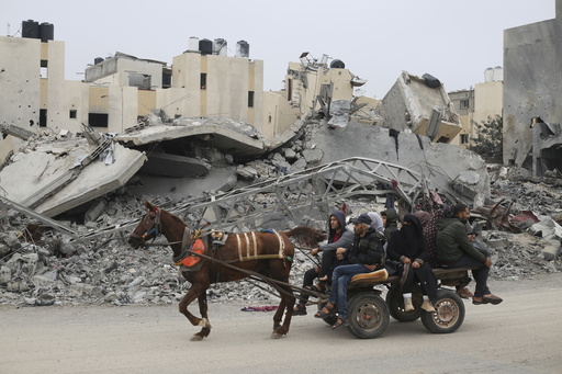 Palestinians fleeing the Israeli ground offensive arrive in Rafah, Gaza Strip, Tuesday, Dec. 5, 2023. (AP Photo/Hatem Ali)