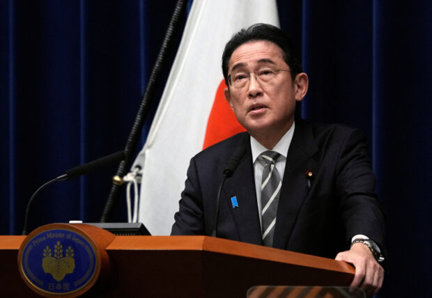 Japan PM purges cabinet in bid to ride out financial scandal