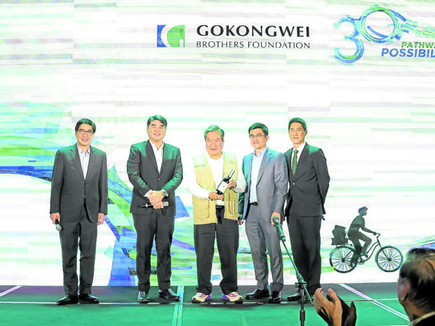 BAND OF BROTHERS The Gokongwei Brothers Foundation (GBF): (From left) Lance Gokongwei,chair; Patrick Henry Go, treasurer; James Go, president and surviving founding brother of GBF; Brian Go, chief finance officer of JG Summit Holdings Inc.; and James Johnson Robert Go Jr., son of GBF trustee