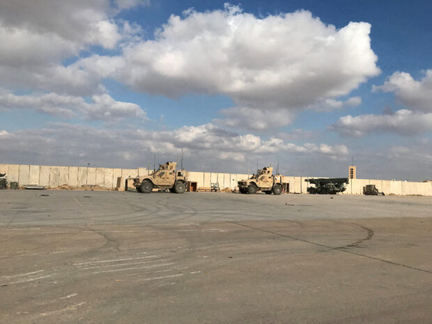 FILE PHOTO: Military vehicles of U.S. soldiers are seen at Ain al-Asad air base in Anbar province