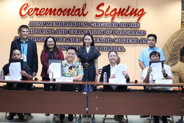 Executives of the Department of Social Welfare and Development, the Department of Budget Management, the National Council on Disability Affairs and the National Commission of Senior Citizens sign the Joint Memorandum Circular No. 1, Series of 2023 on Friday, Dec. 15, 2023. Photo from the DSWD.]