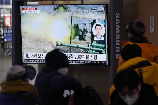 A TV screen shows a file image of North Korea's military exercise during a news program at the Seoul Railway Station in Seoul, South Korea, Saturday, Jan. 6, 2024.