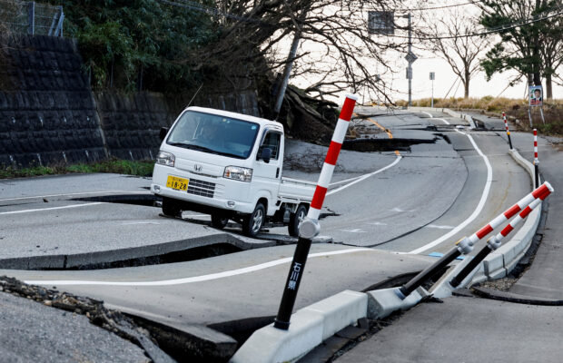 Masatoshi Nakamae drives his car on a damaged road as he heads to his town Soryomachi, which is isolated after the earthquake, in Wajima, Ishikawa Prefecture, Japan, January 6, 2024. REUTERS/Kim Kyung-Hoon