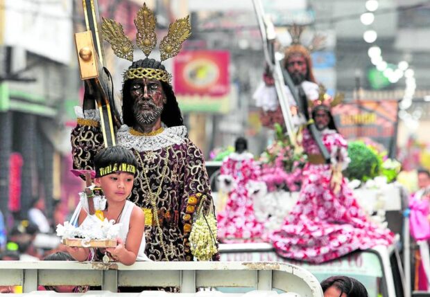Perhaps, sooner or later, this boy would realize a peculiarity in Filipino Catholic traditions: in just 16 days, merrymaking over the birth of Jesus Christ fast-forwards to His road to Calvary. Black Nazarene devotees began flocking to Quiapo Church in Manila on Wednesday, ahead of the Jan. 9 “traslacion.” manila holiday nazarene