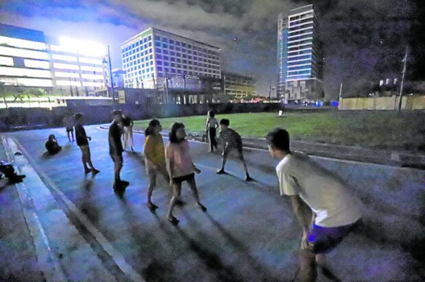 The massive blackout in Western Visayas has at least one welcome effect: children escape from their humid homes, let go of their gadgets and “rediscover” playtime under the stars, like this group photographed Thursday night at Megaworld district in Iloilo City. 