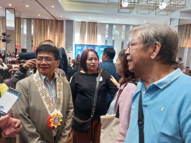 REUNION Former Communist Party of the Philippines chair Rodolfo Salas (left) chats with former comrades, like former Alex Boncayao Brigade chief Nilo dela Cruz (foreground) during a gathering inQuezon City on Saturday. —RYAN D. ROSAURO