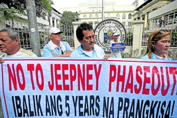 Members of transport groups Piston and Manibela call on the Supreme Court to stop the government from implementing the modernization program for public utility vehicles which will see traditional jeepneys being replaced by minibuses.