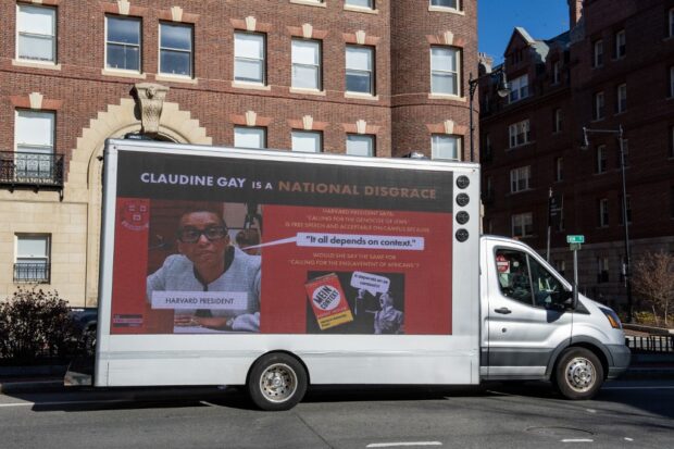 (FILES) A truck calling the president of Harvard a disgrace drives around Harvard University in Cambridge, Massachusetts on December 12, 2023.