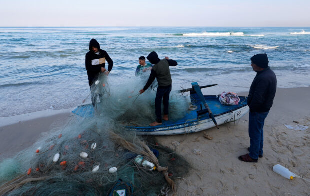 Gaza fishers brave shells for tiny catches in struggle to feed families