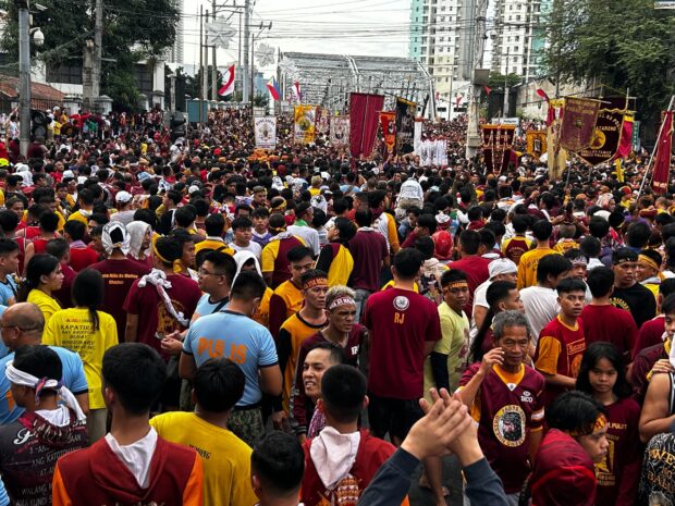 Police are seen patrolling the area where the Black Nazarene is set to pass through near Casal Street. (Photo from Zeus Legaspi)