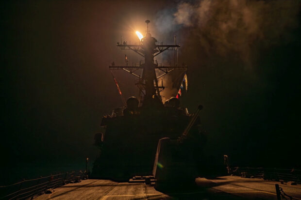 A missile is launched from a warship during the U.S.-led coalition operation against military targets in Yemen