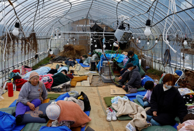Japan quake: survivors face freezing rain, threat of landslides