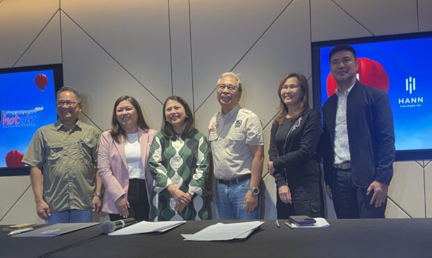 Hann Philippines Inc. signs in as major sponsor of the Philippine International Hot Air Balloon Fiesta at the New Clark City on Feb. 16-18. Capt. Joy Roa of the Asian Air Safari, Joshua Bingcang of the Bases Conversion and Development Authority and Renato Romero of the Land Rover Club of the Philippines sign the agreement.