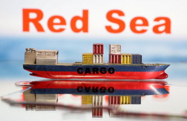 Illustration shows a cargo ship boat model and "Red Sea" words