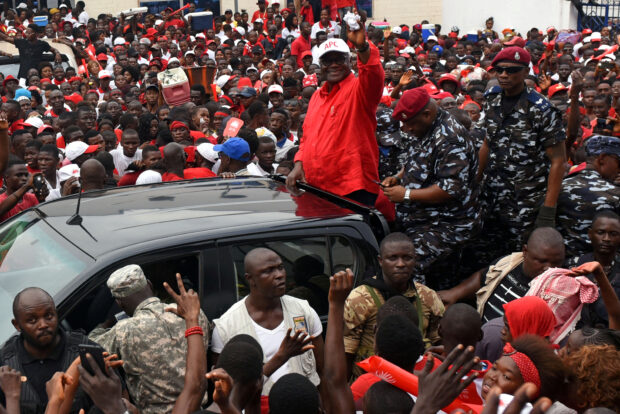 FILE PHOTO: President of Sierra Leone Ernest Bai Koroma waves to supporters of the ruling All Peoples Congress party during a rally ahead of the March 7 presidential election in Makeni