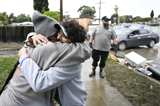 San Diegans cry, hug outside damaged homes after stunning flash floods
