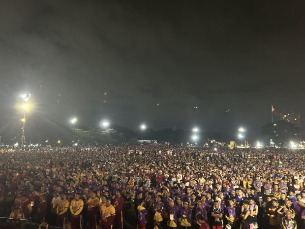 SEA OF HUMANITY: Throngs of devotees at the Quirino Grandstand prepare minutes before the procession begins. 