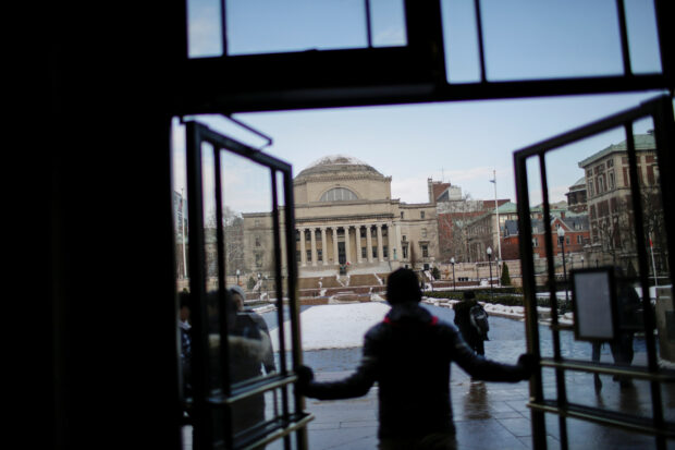 The Library of Columbia University is seen as students walk the campus in New York